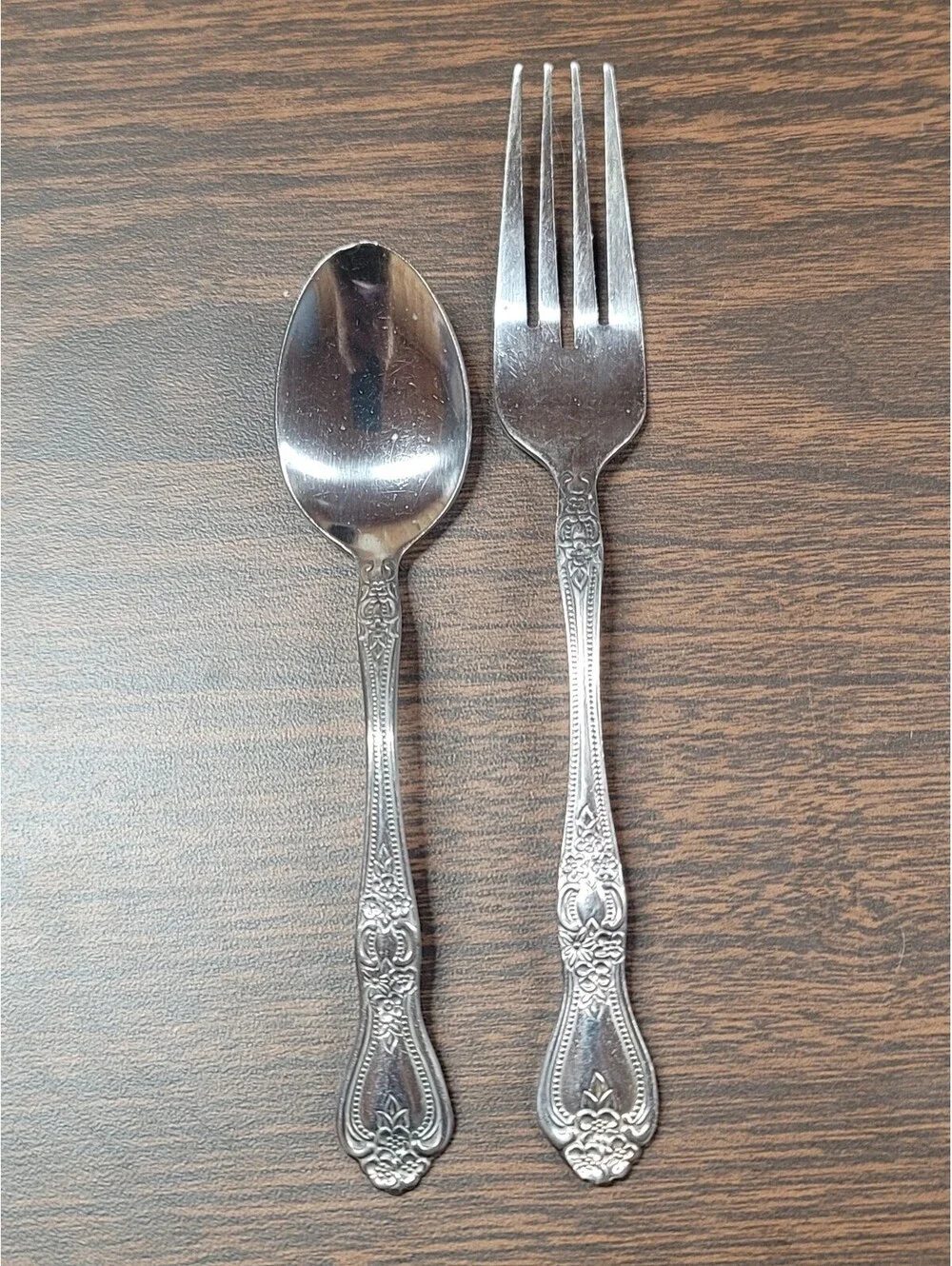 Vintage Stainless Steel Spoon and Fork Set with Ornate Floral Handles